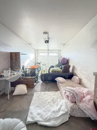 a bedroom with bed and a tv