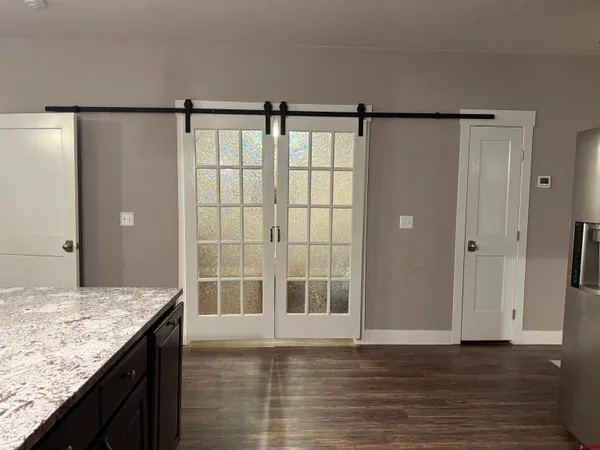 a view of bathroom with granite countertop sink and shower