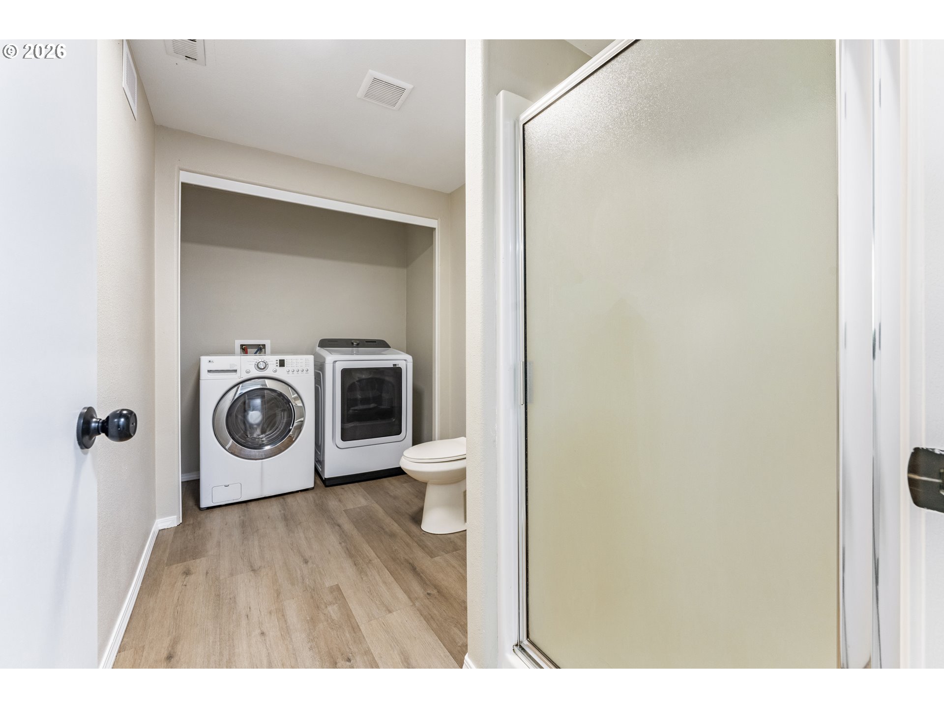 4024 Southeast 154th Place Portland, OR 97236 - Photo 26 of 43 a view of a hallway with washer and dryer