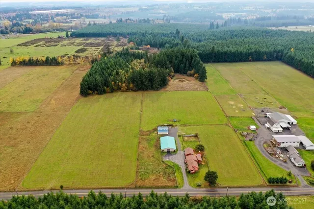 an aerial view of a residential houses with outdoor space