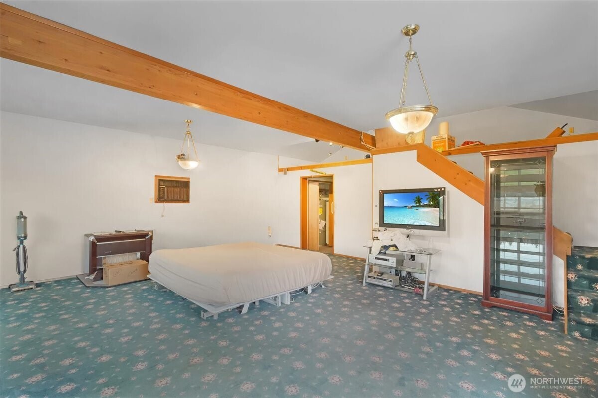 283 Sargent Road Winlock, WA 98596 - Photo 24 of 39 a bedroom with furniture and a flat screen tv