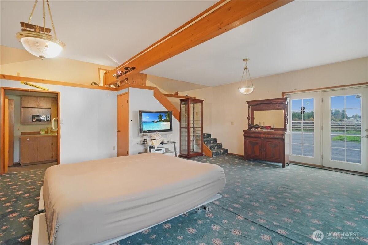 283 Sargent Road Winlock, WA 98596 - Photo 25 of 39 a bedroom with a bed dresser and a large window