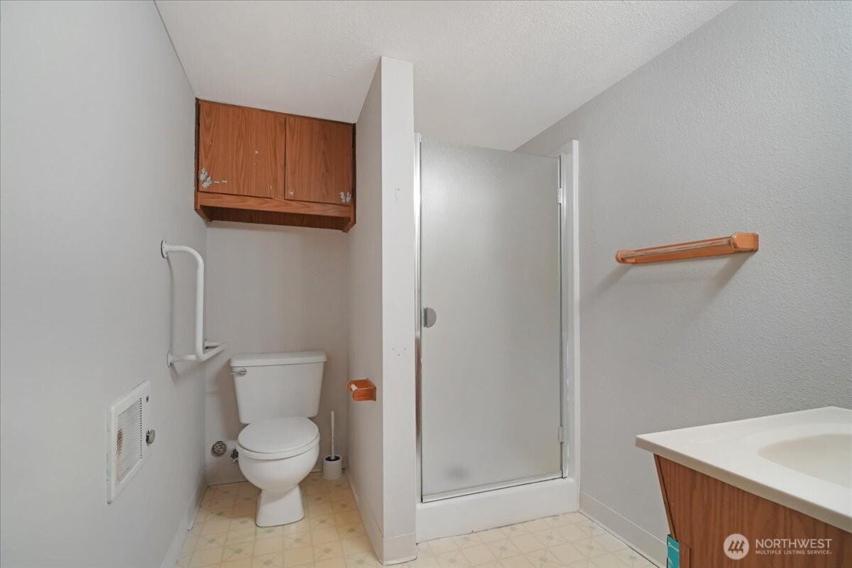 283 Sargent Road Winlock, WA 98596 - Photo 27 of 39 a white toilet sitting next to a shower