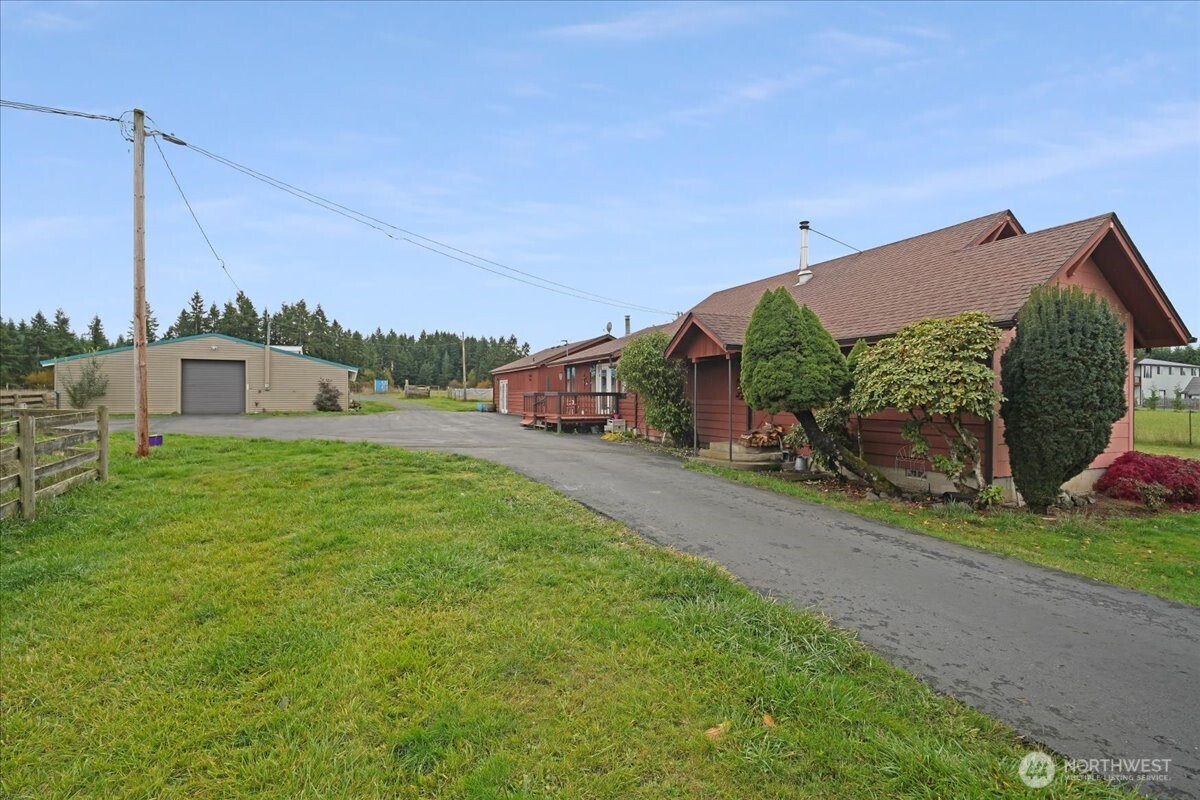 283 Sargent Road Winlock, WA 98596 - Photo 4 of 39 a house view with a play ground in front of it