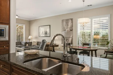 a kitchen with a sink and a refrigerator