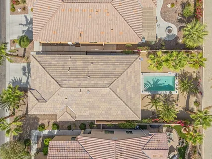 an aerial view of residential houses with outdoor space