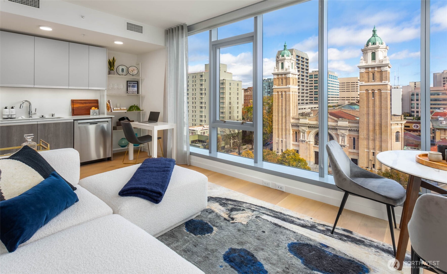a living room with furniture and a large window