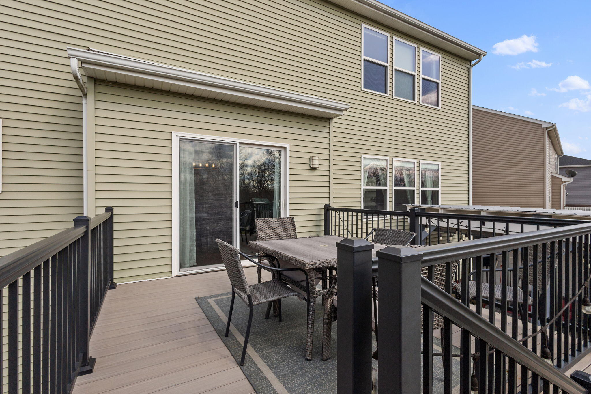 12938 Hayes Street Crown Point, IN 46307 - Photo 24 of 32 a view of a dinning table and chairs in patio of the house