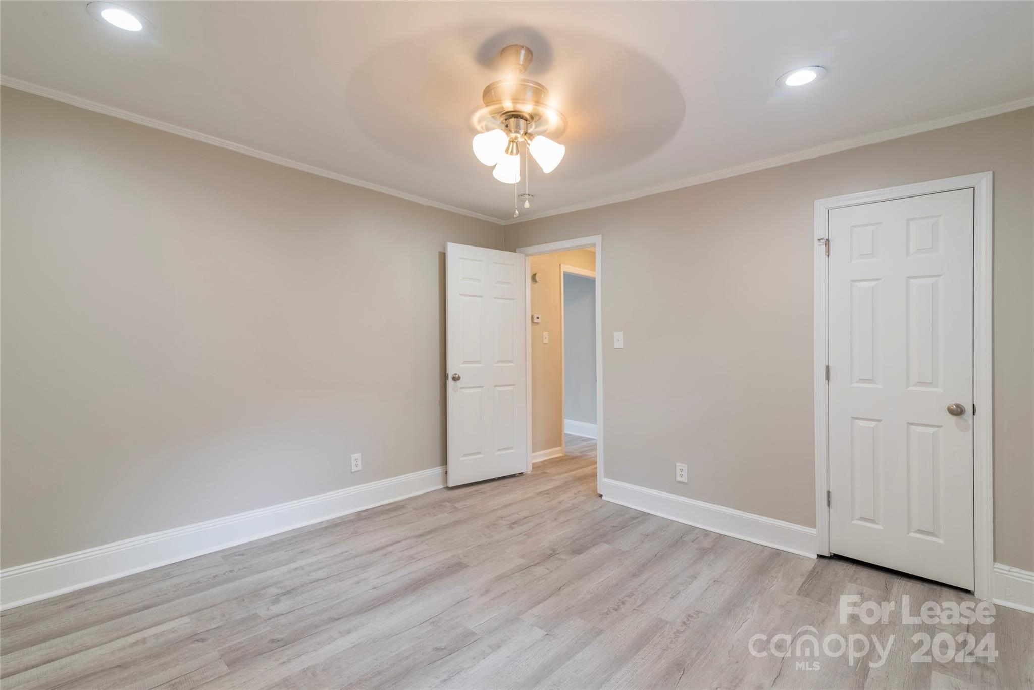 2336 Barry Street, Unit B Charlotte, NC 28205 - Photo 12 of 18 wooden floor in an empty room with a window