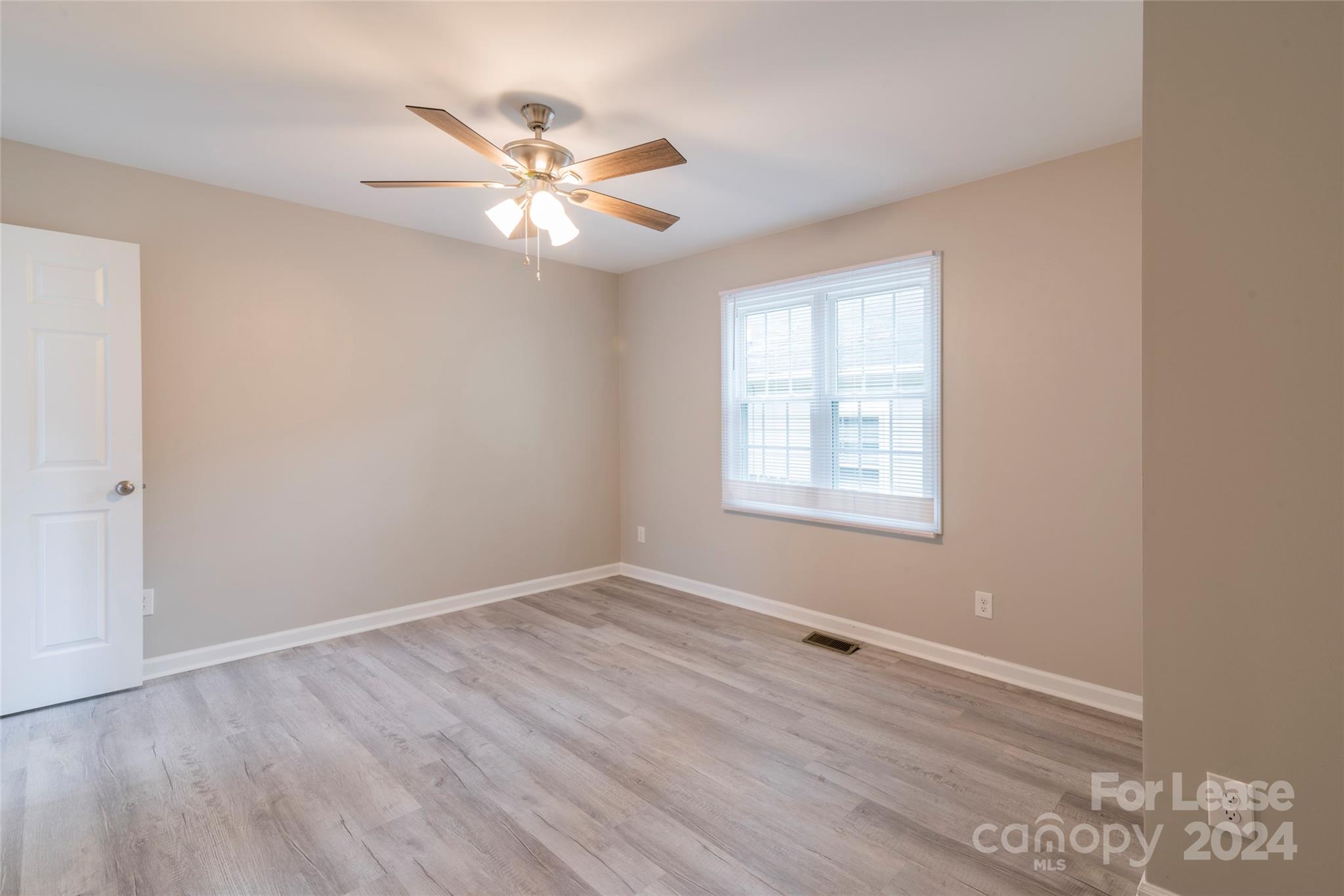 2336 Barry Street, Unit B Charlotte, NC 28205 - Photo 15 of 18 a view of wooden floor and windows in a room
