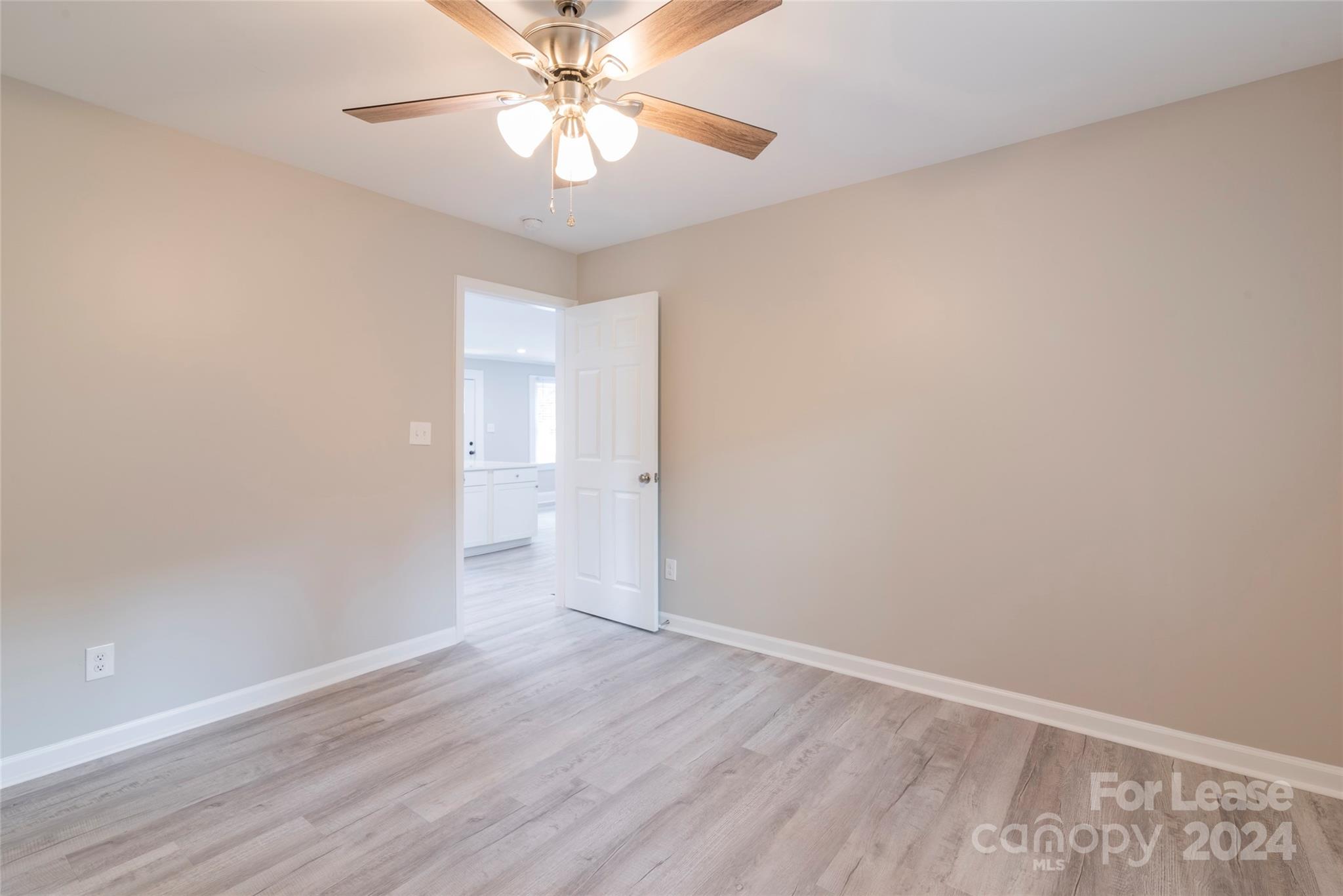 2336 Barry Street, Unit B Charlotte, NC 28205 - Photo 16 of 18 wooden floor in an empty room with a window