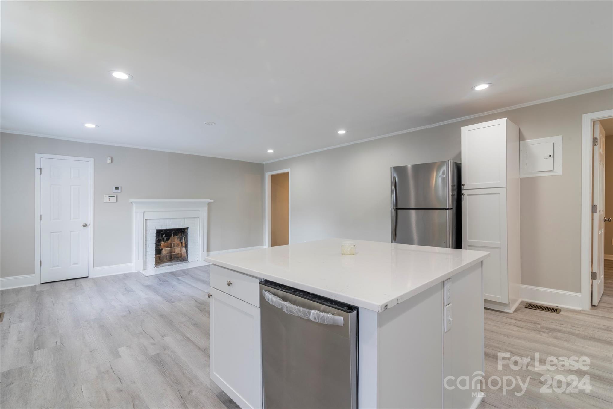 2336 Barry Street, Unit B Charlotte, NC 28205 - Photo 4 of 18 a view of kitchen with cabinets and wooden floor