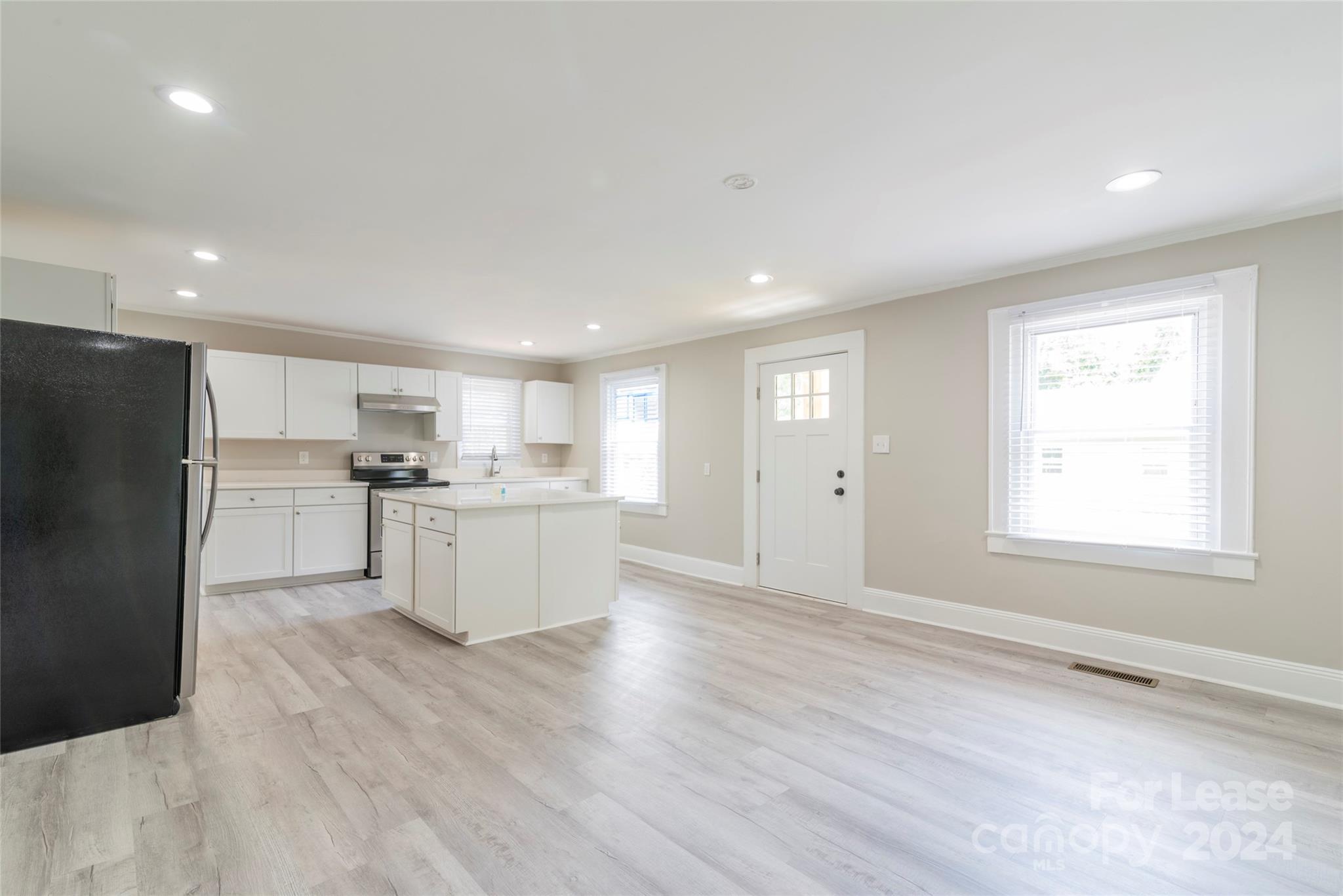 2336 Barry Street, Unit B Charlotte, NC 28205 - Photo 5 of 18 a view of kitchen with wooden floor and electronic appliances