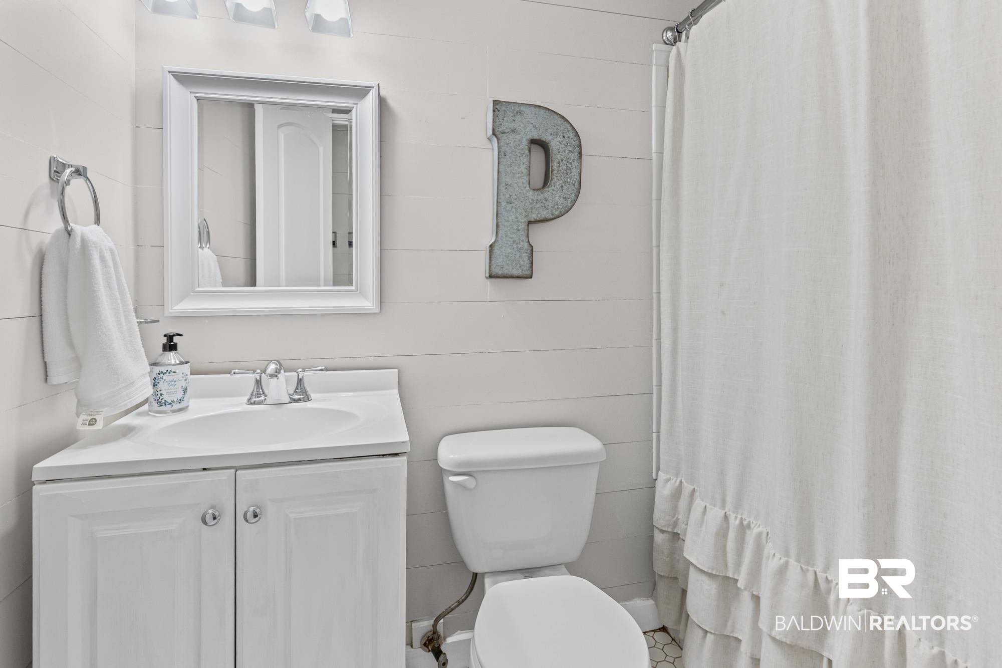 11100 Rhett McConnell Road Theodore, AL 36582 - Photo 14 of 47 Bathroom featuring vanity and a shower with curtain