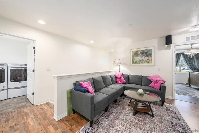 a living room with furniture and a rug