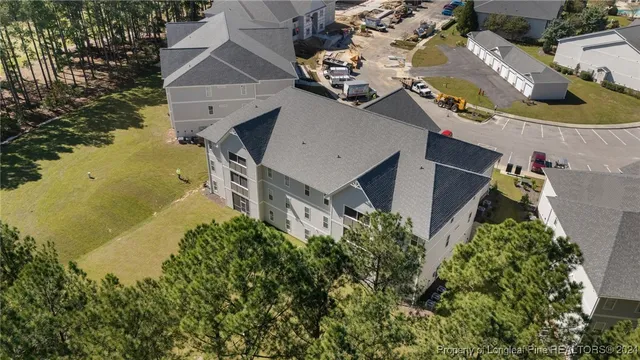 an aerial view of house with yard swimming pool and outdoor seating