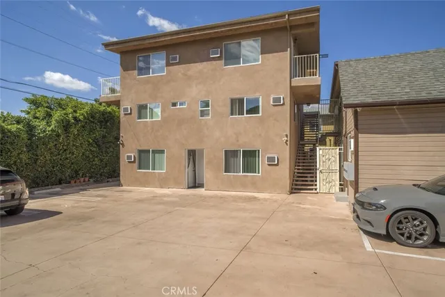 a front view of a house with parking space