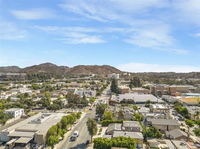 an aerial view of residential houses and city view