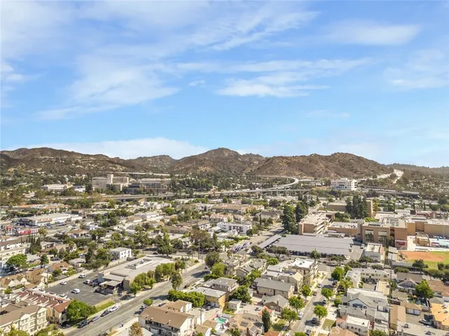 an aerial view of residential house and green space