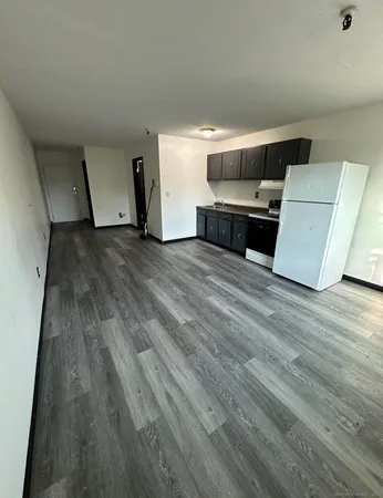 a view of kitchen and wooden floor