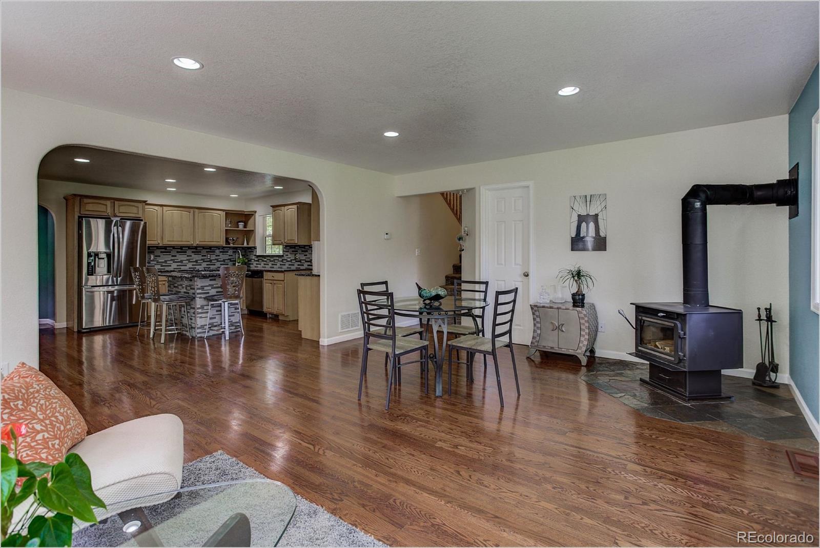 4961 Little Cub Creek Road Evergreen, CO 80439 - Photo 13 of 38 a living room with furniture and wooden floor