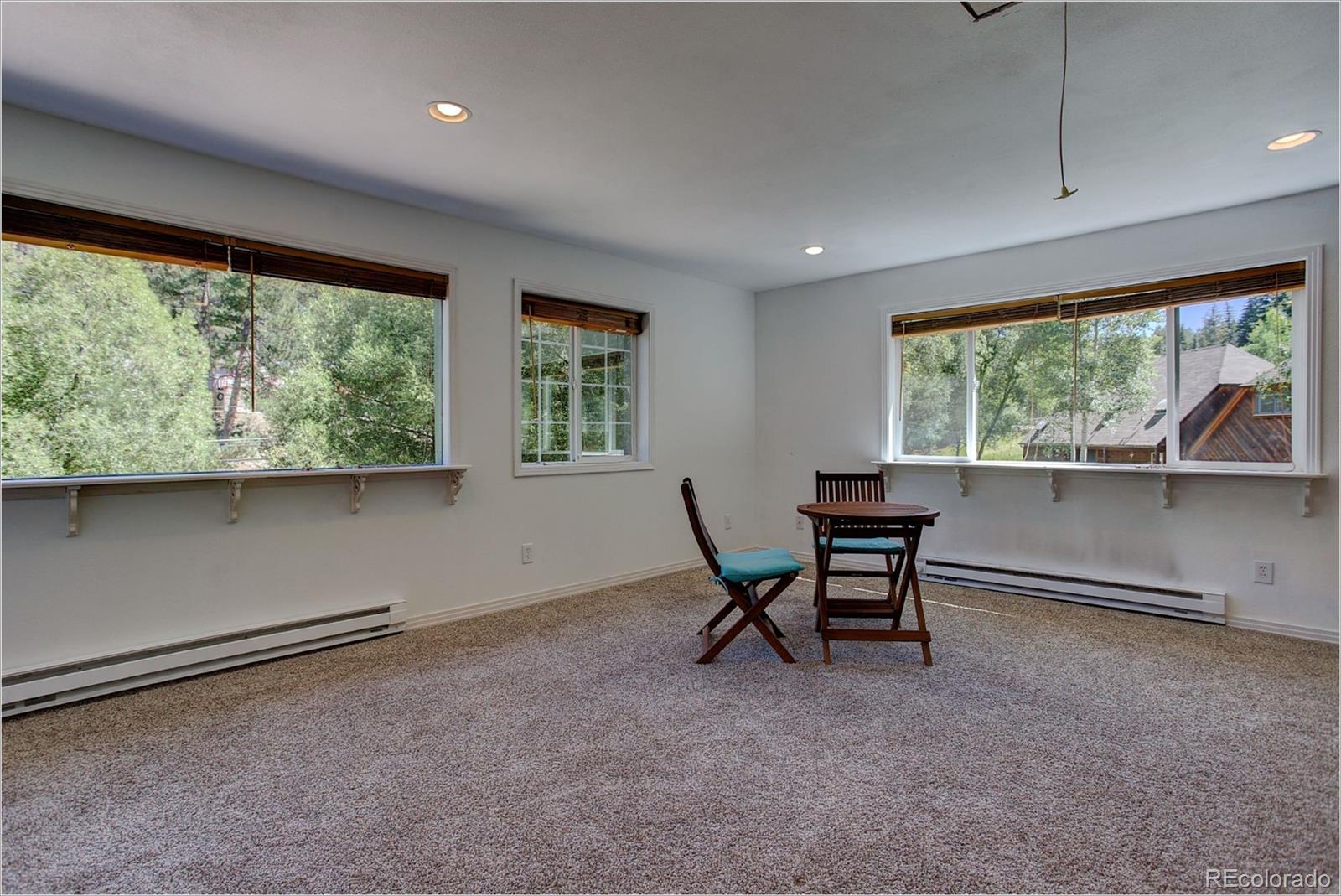 4961 Little Cub Creek Road Evergreen, CO 80439 - Photo 33 of 38 a workspace with furniture and a window