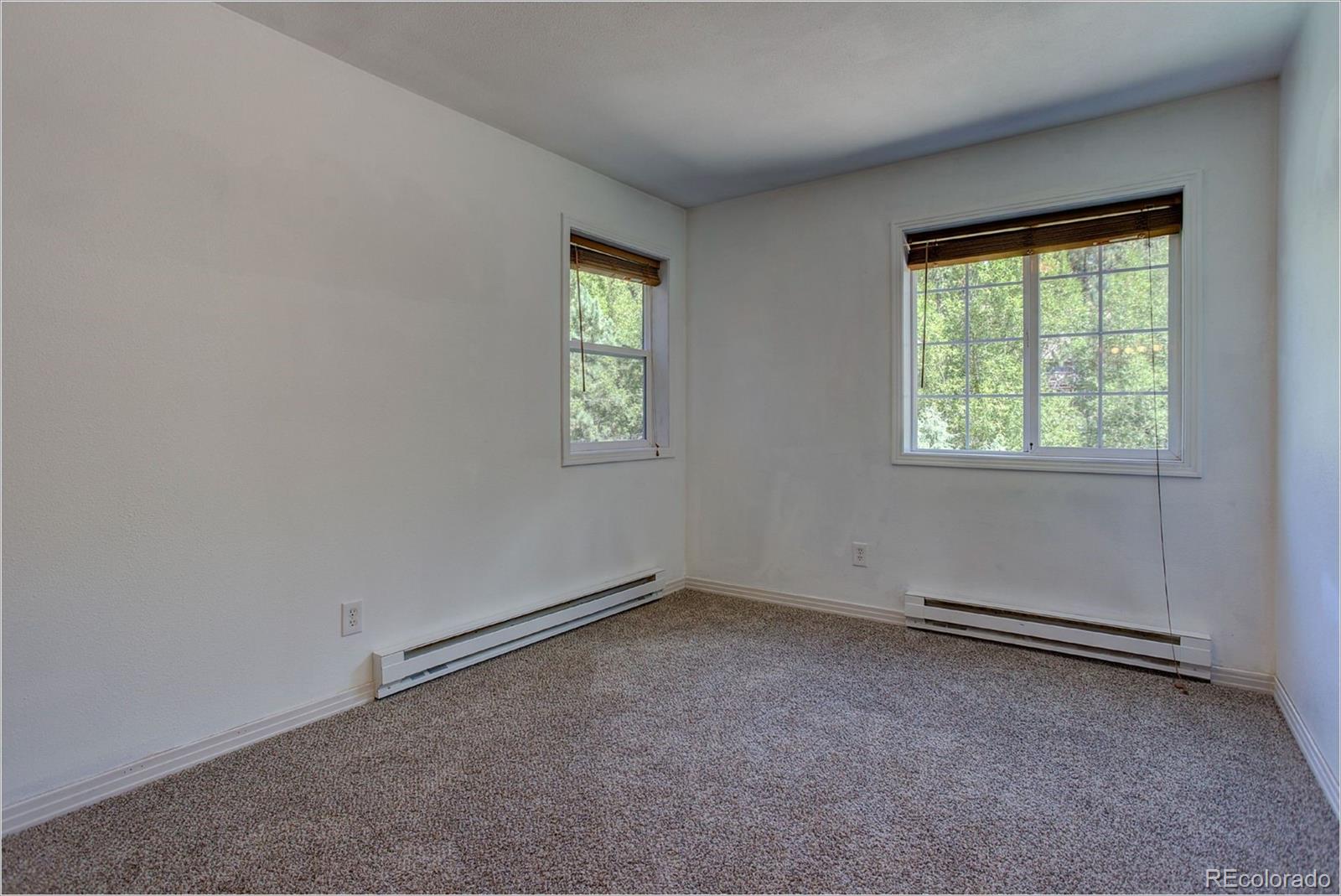 4961 Little Cub Creek Road Evergreen, CO 80439 - Photo 34 of 38 an empty room with a window