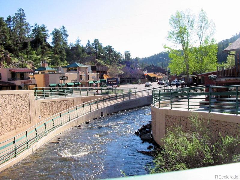 4961 Little Cub Creek Road Evergreen, CO 80439 - Photo 37 of 38 a view of swimming pool with outdoor seating
