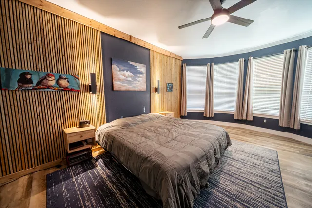 a front view of a house with a garden and yard