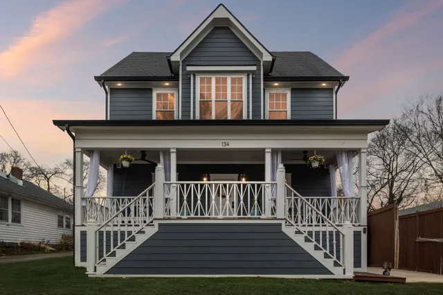a living room with patio a couch and chairs