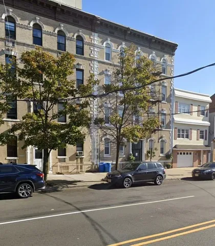 a view of a cars parked in front of a building