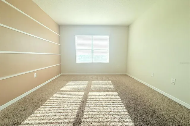 a spacious bathroom with a mirror sink and