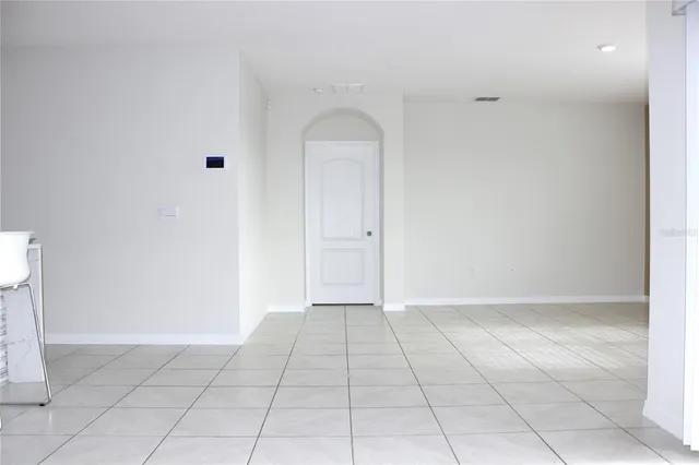 a view of a kitchen with a sink and a refrigerator