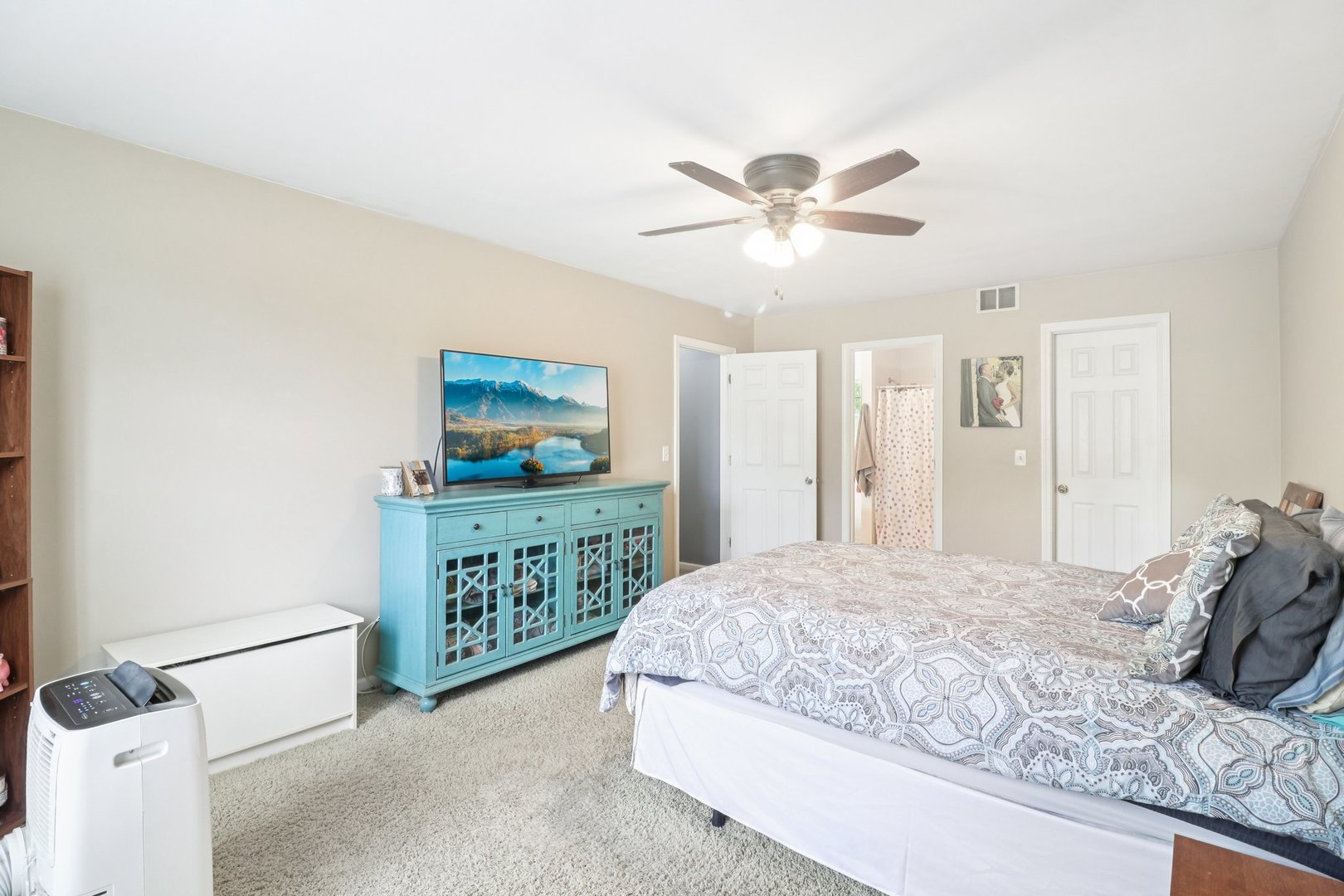 1256 Edgewater Lane Antioch, IL 60002 - Photo 20 of 45 a bedroom with a bed and a flat screen tv