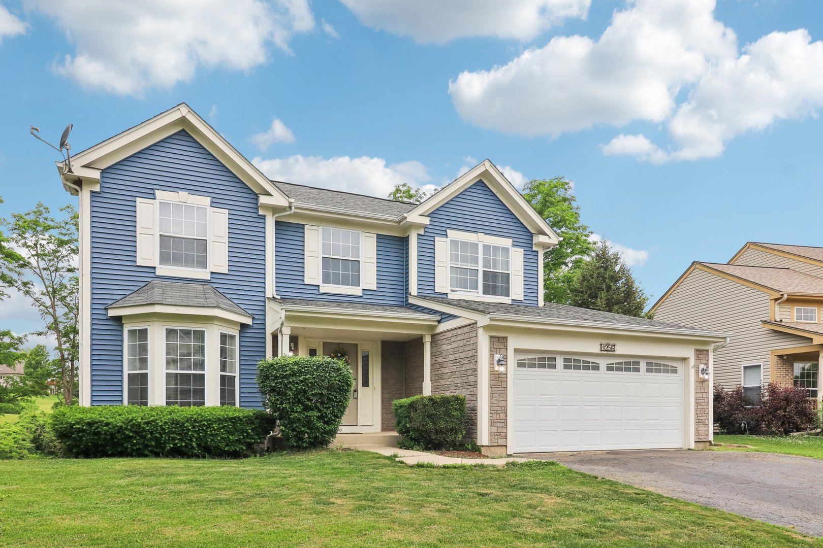 1256 Edgewater Lane Antioch, IL 60002 - Photo 2 of 45 a front view of a house with a yard