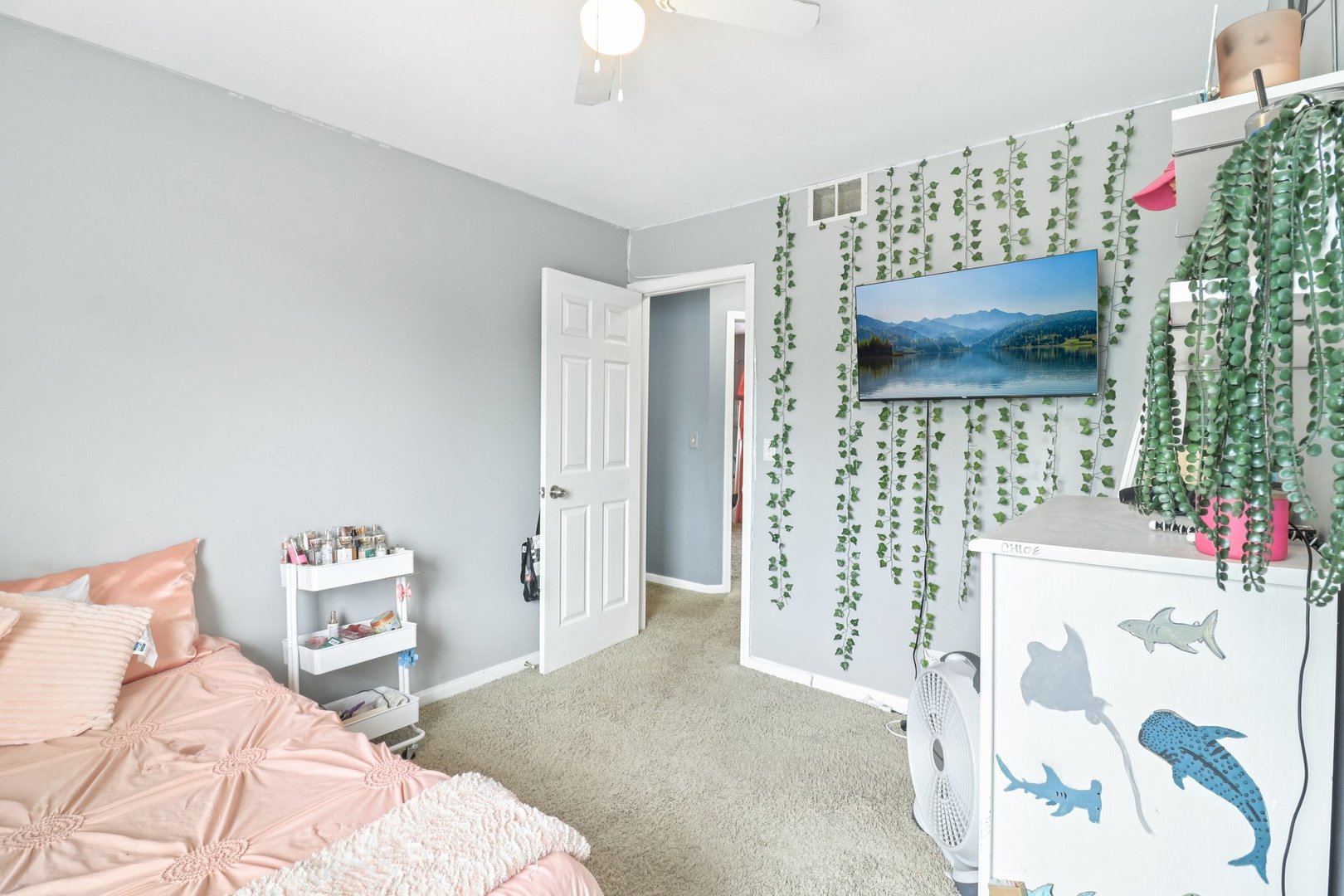 1256 Edgewater Lane Antioch, IL 60002 - Photo 24 of 45 a bedroom with a bed and a flat screen tv