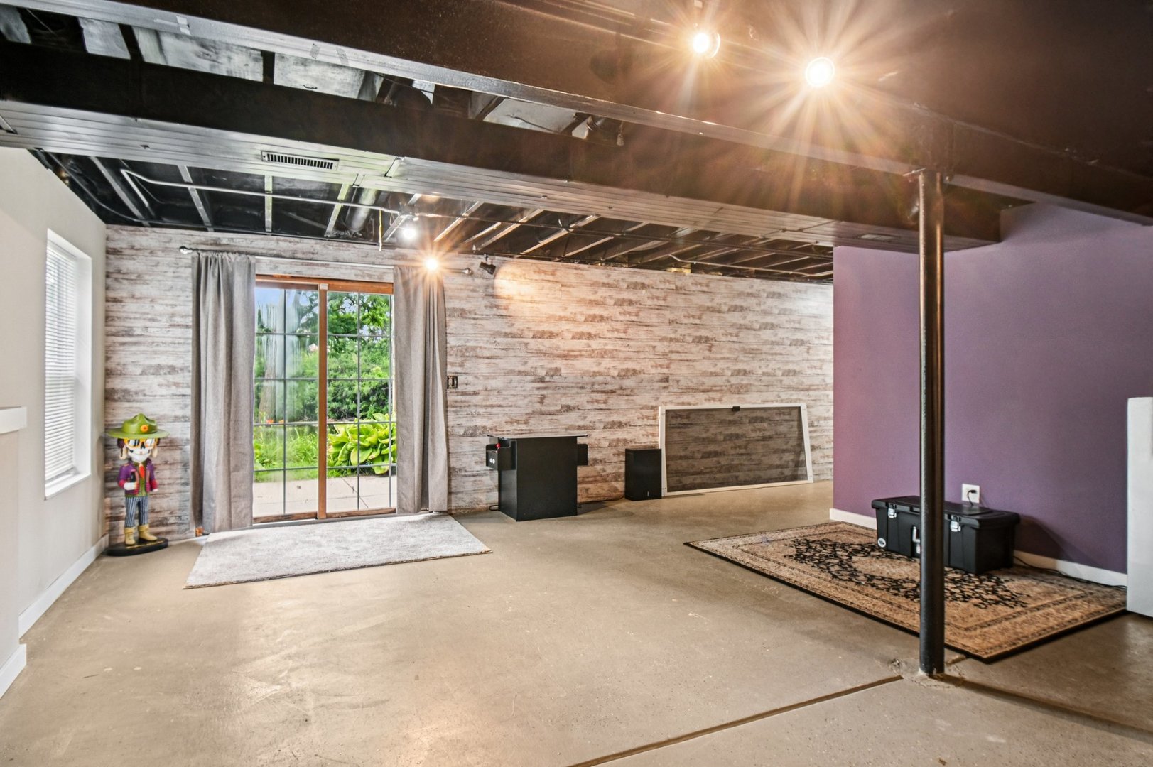 1256 Edgewater Lane Antioch, IL 60002 - Photo 36 of 45 a view of an empty room with wooden floor and a fireplace