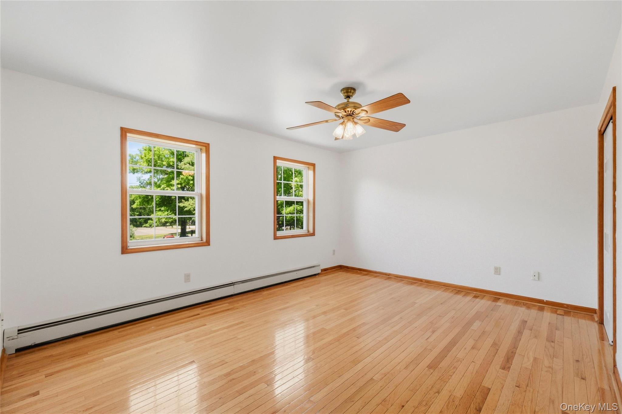 5 Horton Road Washingtonville, NY 10992 - Photo 26 of 42 a view of an empty room with a window and wooden floor