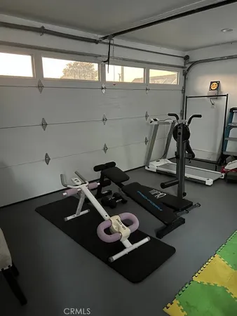 a view of a livingroom with furniture and staircase