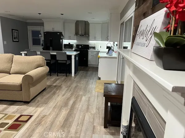 a view of a kitchen with a sink and cabinets