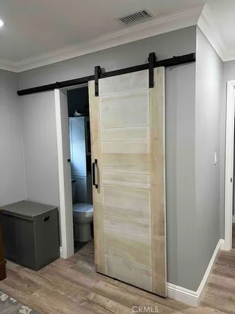 a bathroom with a glass shower door and a sink