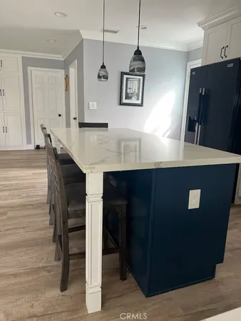 a bathroom with a granite countertop shower and a tub