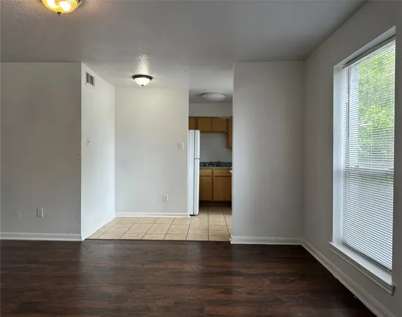 a view of wooden floor and a sink in a room