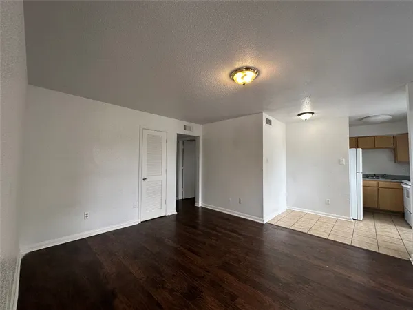 a view of a livingroom with wooden floor