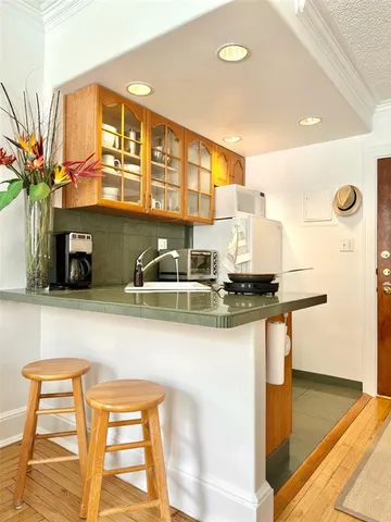 a kitchen with stainless steel appliances granite countertop a sink and a cabinets