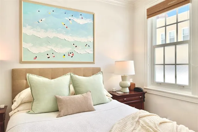 a bedroom with furniture and window