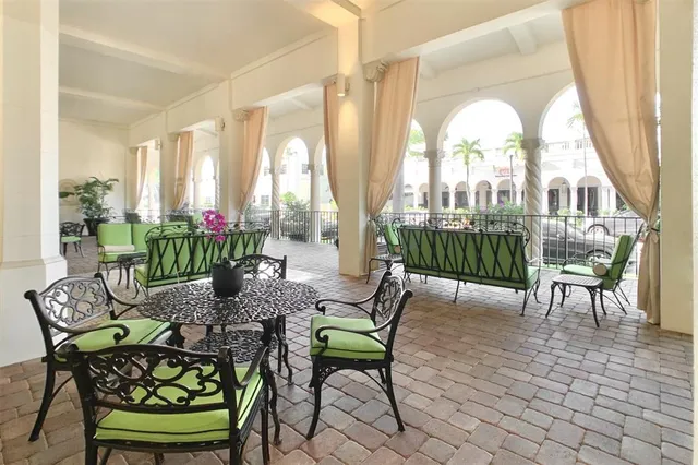 a view of a dining room with furniture window and outside view