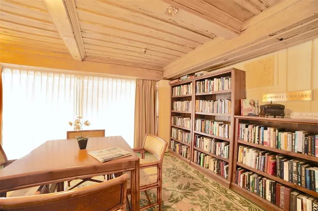 a room with furniture and book shelf