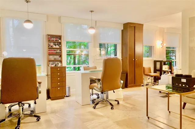 a view of a livingroom with workspace and a window