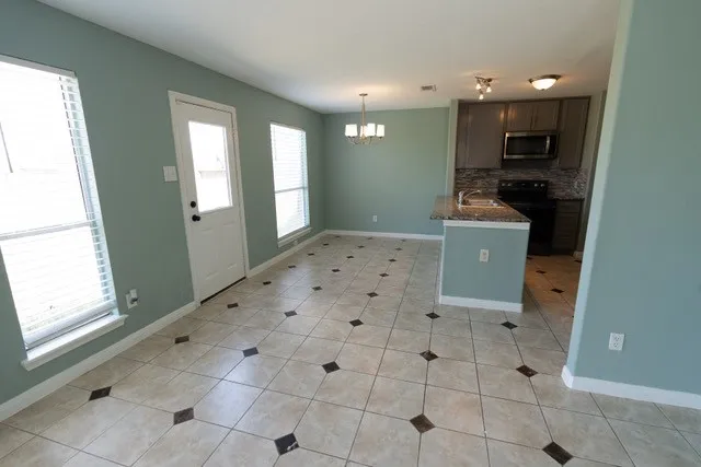 a view of kitchen with furniture and window
